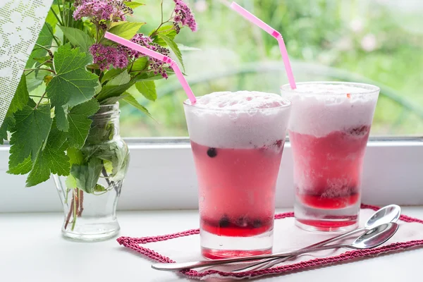 Fruit cocktail with ice cream and flowers on the window — 스톡 사진