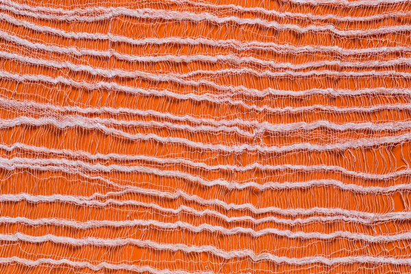 Orange background with tenuous gauze on the surface — Stock Fotó