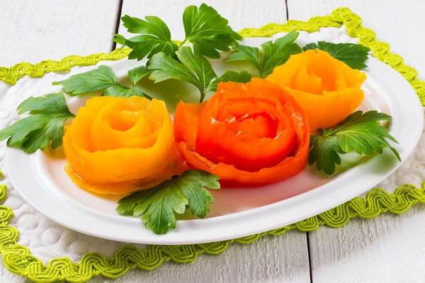 Simple decoration for festive dishes - roses from tomatoes — Stockfoto