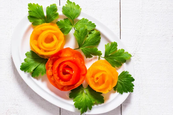 Home decoration for festive dishes - roses from tomatoes