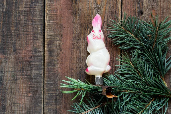 Old Christmas toy rabbit on a branch — Zdjęcie stockowe