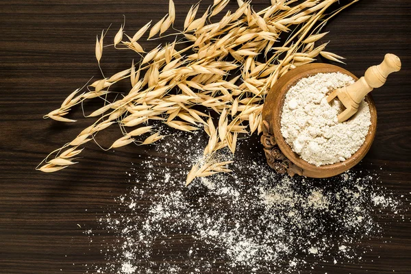 The stalks of oats and oat flour — Stock Photo, Image