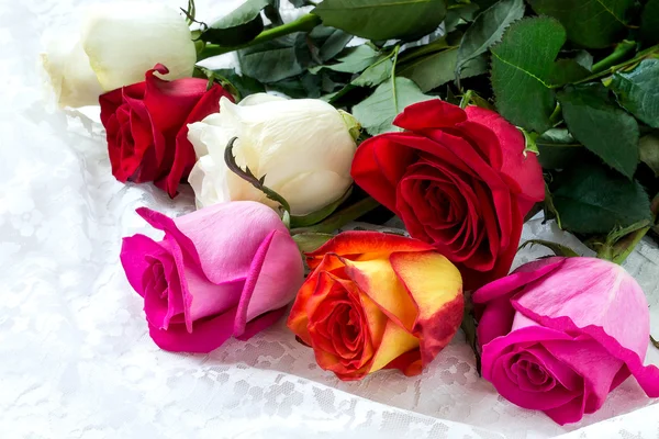 Bouquet of multicolored roses in a gift — Stock Photo, Image