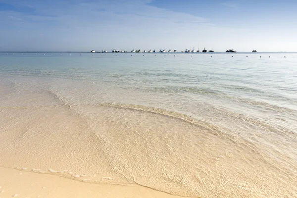 Ships near tropical island — Stok fotoğraf