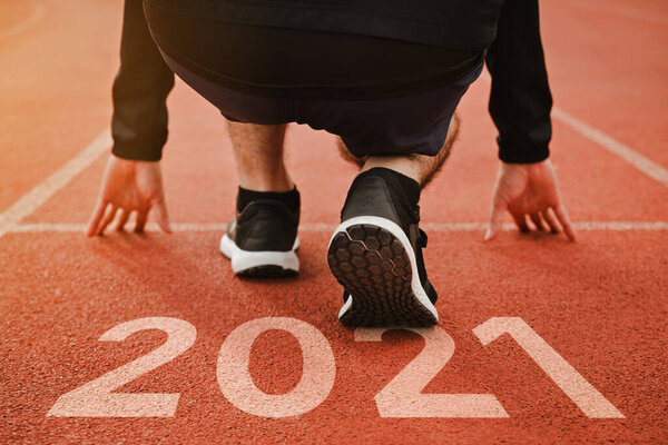 Start of Man running on running court .Start to new year 2021 plans.Goal of Succes