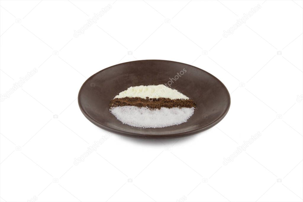 morning cheerfulness charge: ground coffee, dry skim cream and granulated sugar prepared on a brown plate for brewing a delicious drink, 3 in 1, close, isolated on white