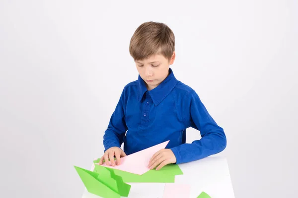 Origami Boy Stares Sheet His Hands Finished Paper Crafts — Stock Photo, Image