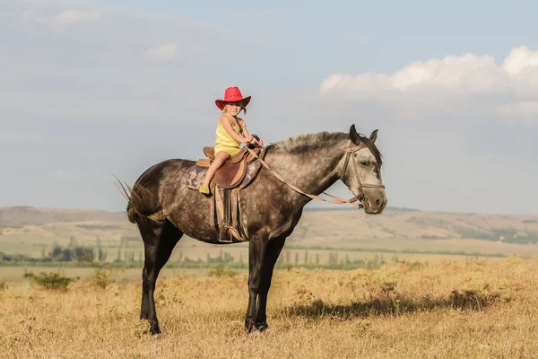 Outdoor portrait of young happy girl riding a horse on farm, rur — Stock Photo, Image