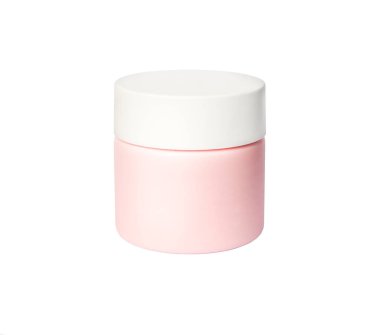 Beyaza izole edilmiş bir güzellik kreminin pembe plastik kavanozu.