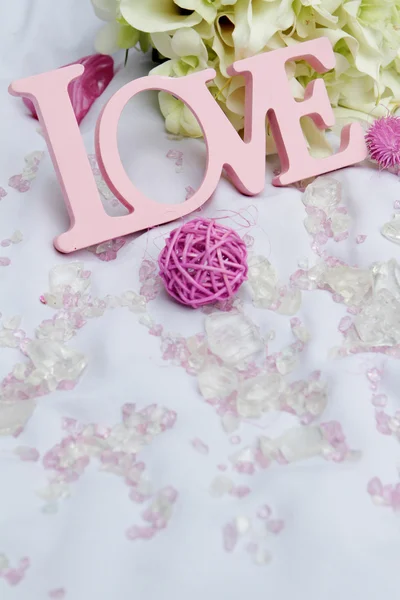 Word love and decoration details over white, wedding decor — Stock Photo, Image