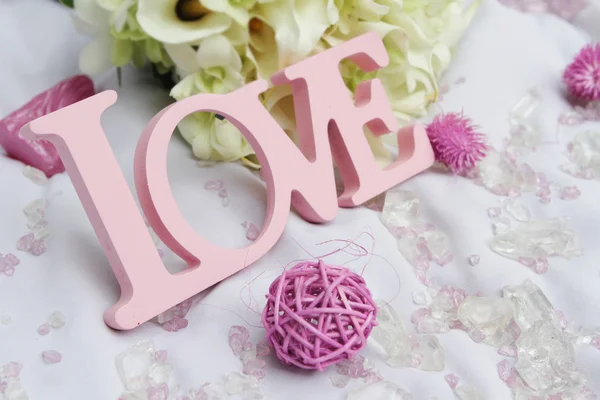 Word love and decoration details over white, wedding decor — Stock Photo, Image