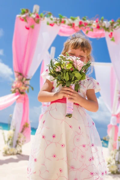 Young happy kid girl in beautiful dress on tropical wedding setu — Stock Photo, Image