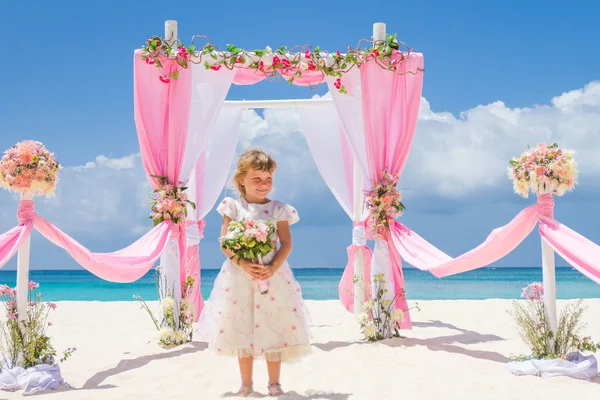 Young happy kid girl in beautiful dress on tropical wedding setu — Stock Photo, Image