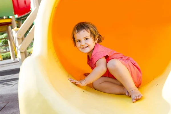 Linda niña feliz en el parque infantil —  Fotos de Stock