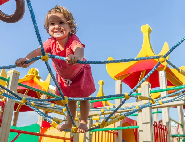 Cute happy child girl on playground — Stock Photo, Image