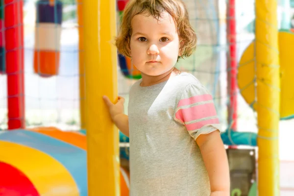 Linda niña feliz en el parque infantil —  Fotos de Stock