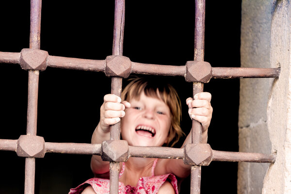 chid girl in prison, cage