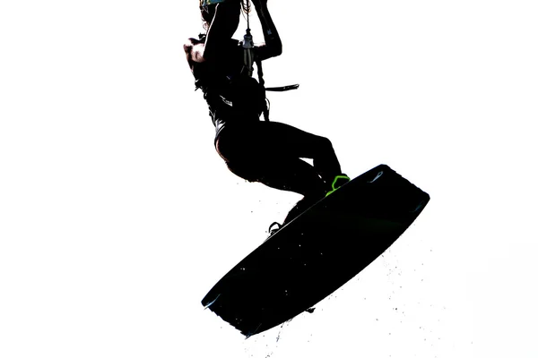 A young woman kite-surfer jumping, isolated over white — Stock Photo, Image