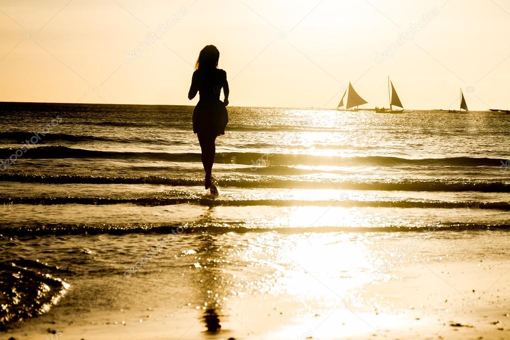 young beautiful woman enjoying summer vacations on tropical beac