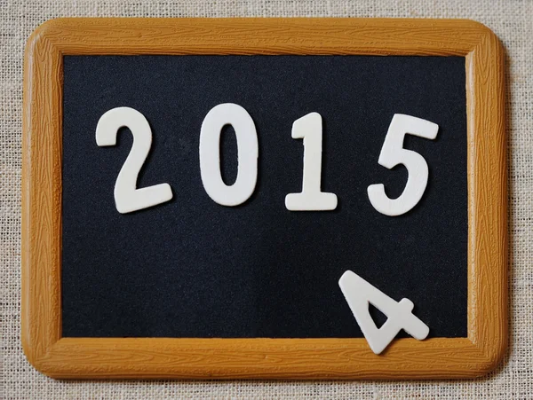 New year 2015 replaces 2014 concept on blackboard — Stock Photo, Image