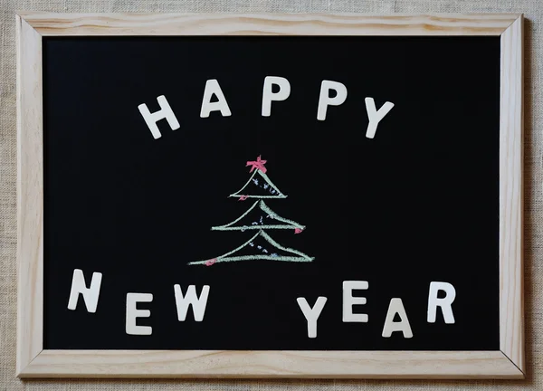 Gelukkig nieuw jaar christmas tree op blackboard — Stockfoto