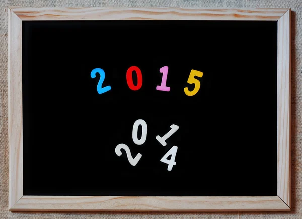 New year 2015 replaces 2014 concept on blackboard — Stock Photo, Image