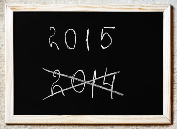 New Year coming concept - 2015 and 2014 written on a blackboard — Stock Photo, Image