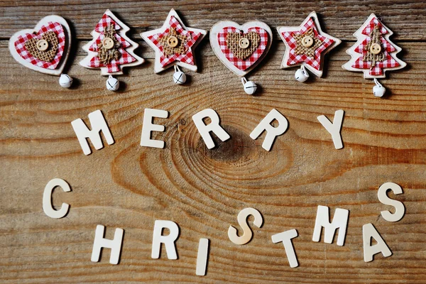 Merry Christmas greeting message and decoration on wooden background — Stock Photo, Image
