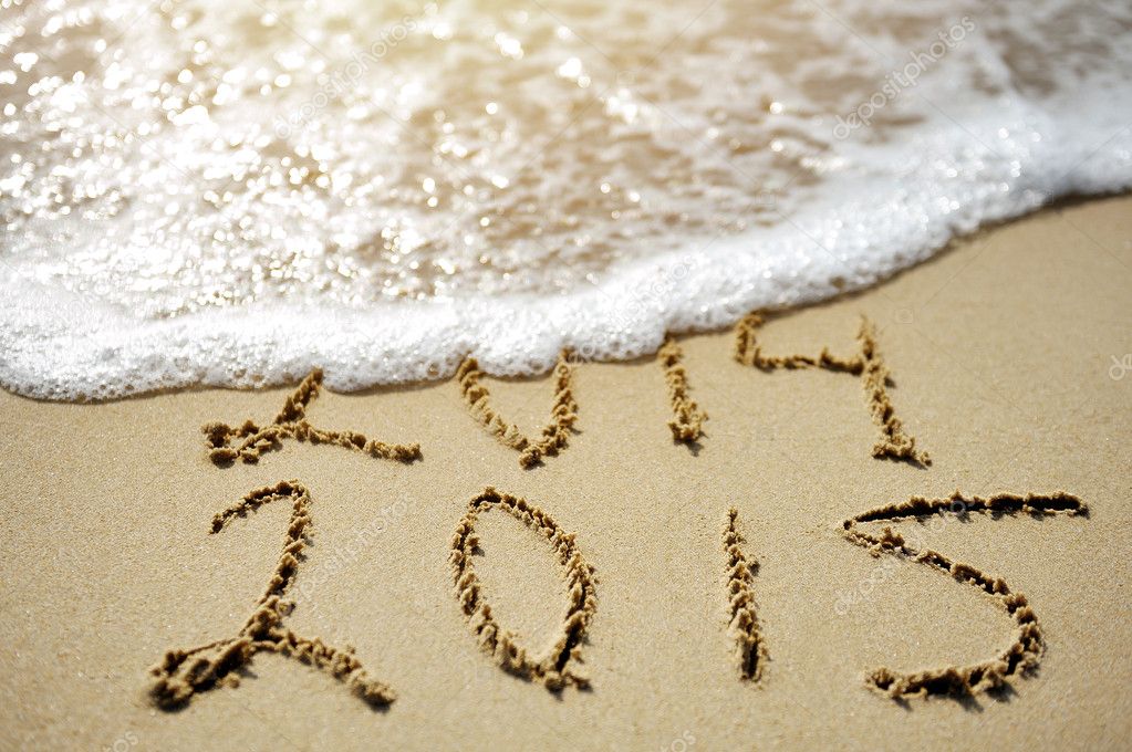 Happy Near Year concept 2015 replace 2014 on sea beach