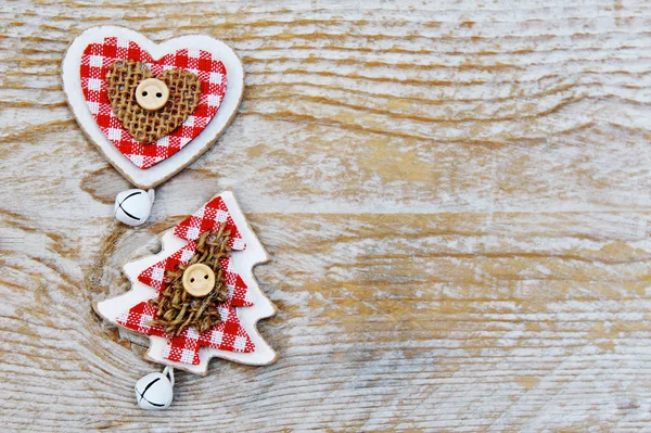 Christmas tree and heart decoration on wooden background — Stock Photo, Image