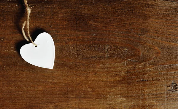 White heart on a vintage wooden background — Stock Photo, Image