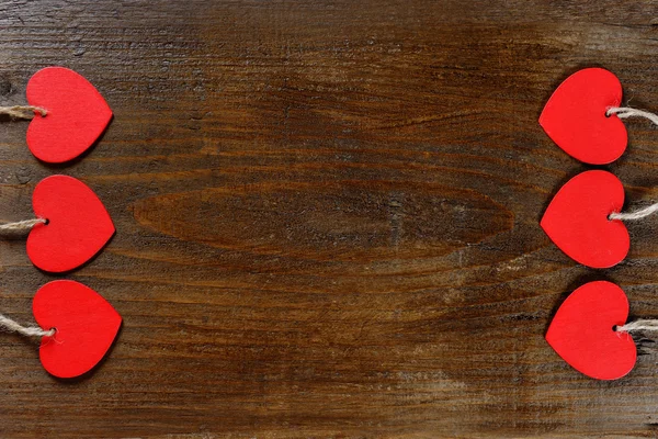 Red hearts on wooden background - valentine day — Stock Photo, Image