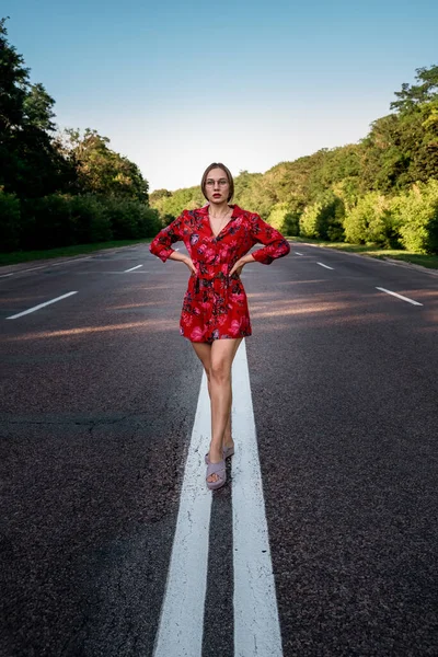 New way, new start, New year resolution, challenge, choice or change concept. Young Woman walking on the summer road with tree around