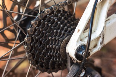 Mountain bike used and dirty gear cassette cogs macro close up shot outside