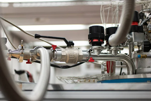 Industrial research lab instruments piping detail close up isolated shot.