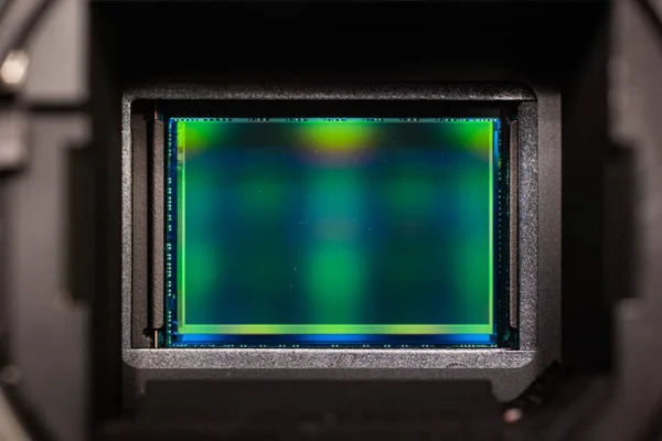 Digital mirror less photography imaging sensor macro close up shot inside bayonet mount enclosure.