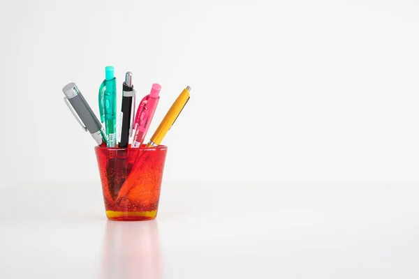 Different Colorful Pens Red Stained Glass Cup Isolated White Front — Stock Photo, Image