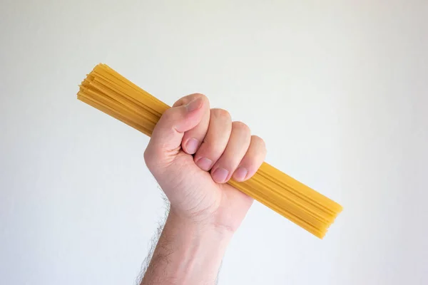 Caucasian Male Hand Holding Stack Raw Long Spaghetti Close Shot — Fotografia de Stock