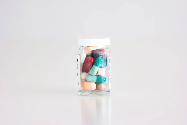 Glass Bottle Full Various Colored Medical Pills Tablets Capsules Close — Stock Photo, Image