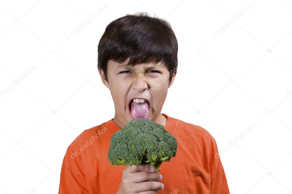 Boy holding broccoli