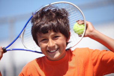 Young boy with tennis raquet
