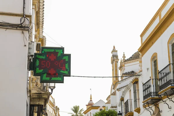 Street thermometer on the LED sign of a pharmacy showing a temperature of 49 degrees Celsius, 120,2F. Climate change is causing very high temperatures in some parts of the world.