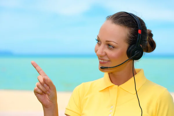 Cheerful female call center with headset on the sky background — Stock Photo, Image