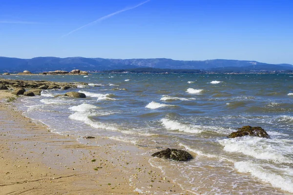 Nortd wind waves on the shore of Sinas beach in Vilanova de Arousa, Galicia, Spain