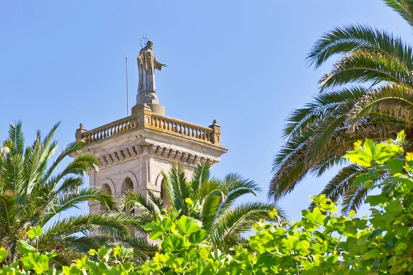 Jesus Christ over the bell tower of San Esteban church — Stock Photo, Image