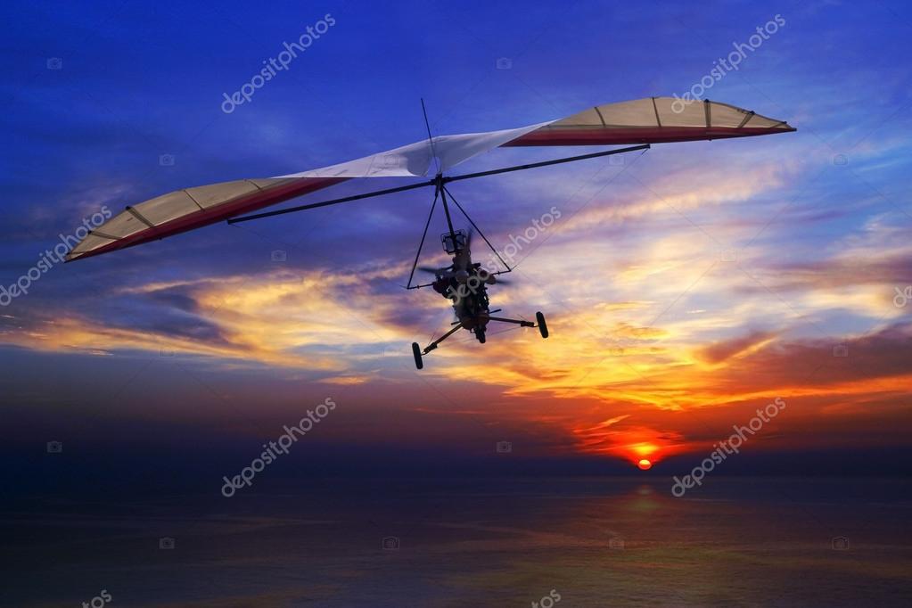 depositphotos_100031670-stock-photo-hang-glider-in-the-sunset.jpg