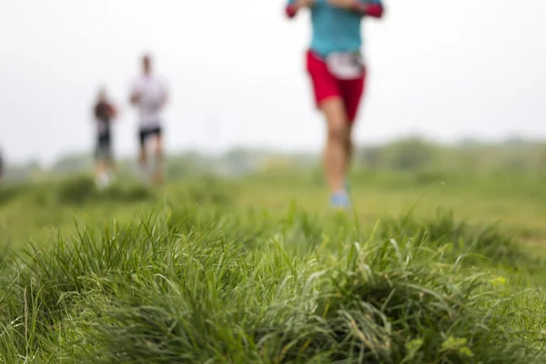 Marathon cross-country wazig beweging uitgevoerd, — Stockfoto