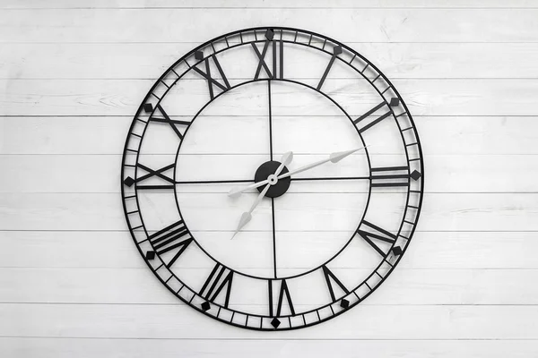 Black clock on white background — Stock Photo, Image