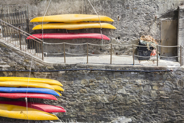 Plastic canoes, hanging on the wall