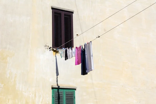 Drying clothes on the wall — Stock Photo, Image